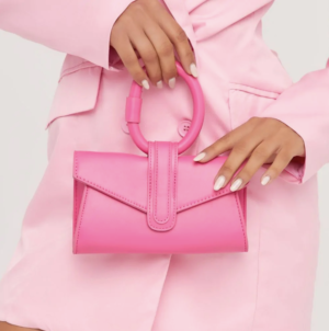 round top handle pink clutch bag