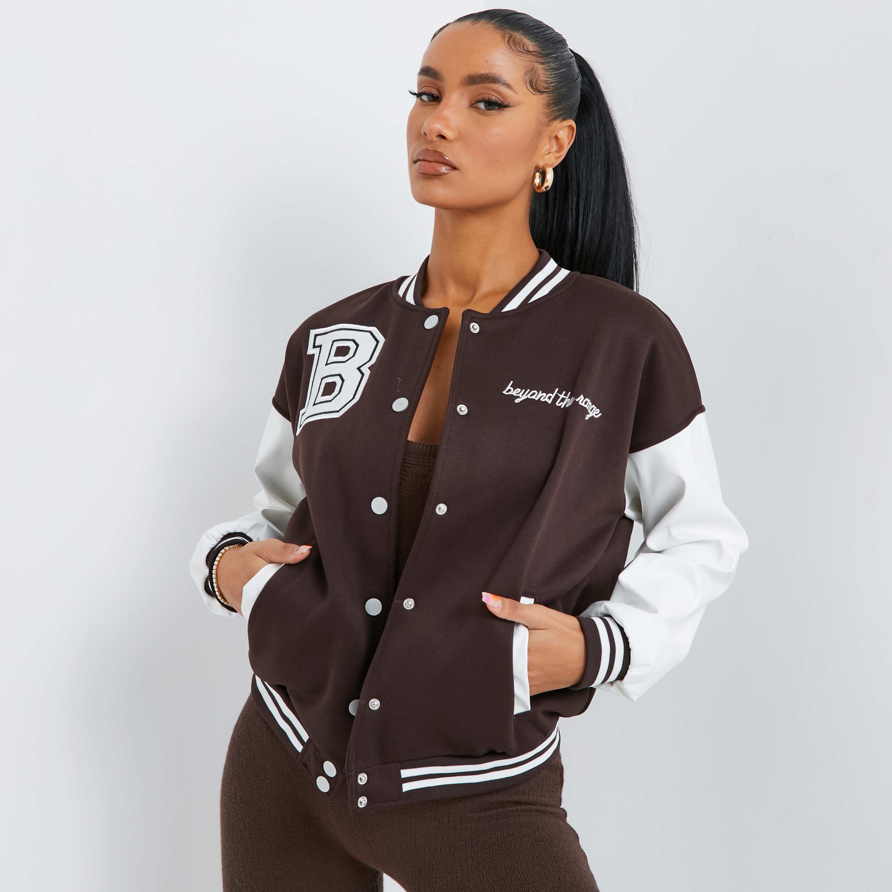 brown varsity jacket outfit girl